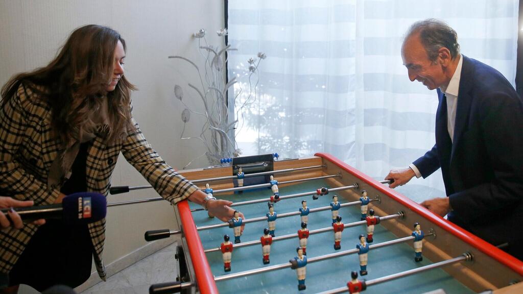 Then a media pundit considering a presidential run, Zemmour plays table football with Knafo 