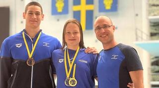 אנסטסיה גורבנקו ודוד גרצ'יק עם המאמן אהוד סגל