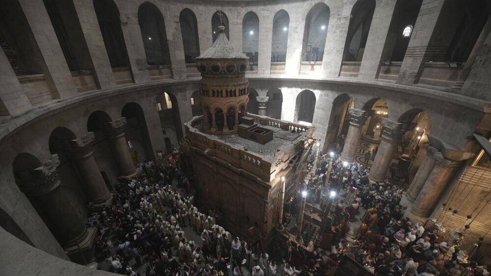 Orthodox Christian clergy marks Palm Sunday at the Church of the Holy Sepulchre, Sunday, April 17, 2022 