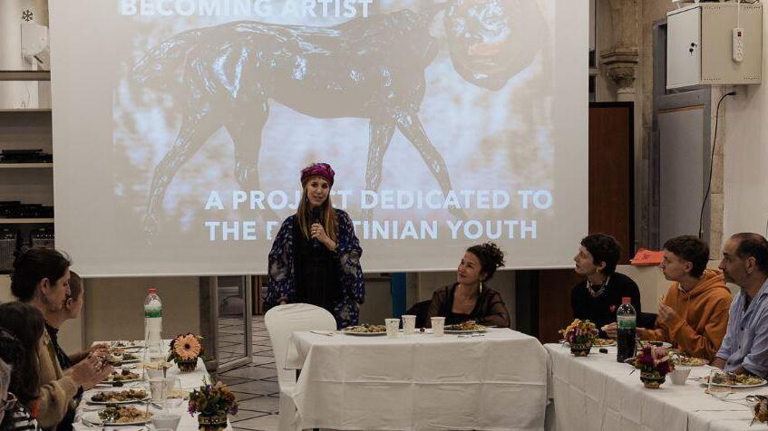Brazilian artist Sofia Borges speaks at the iftar program at the Ibdaa School of the Arts in Jerusalem, April 13, 2022