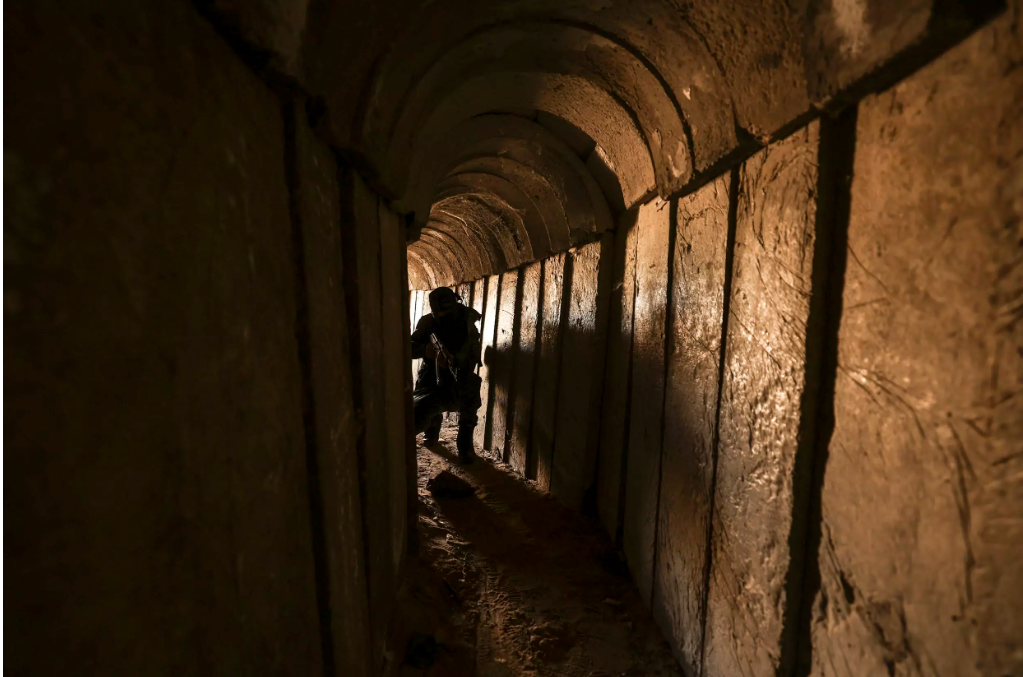 Members of the Palestinian Islamic Jihad militant group enter a tunnel in the Gaza Strip, during a media tour amid escalating tensions with Israel