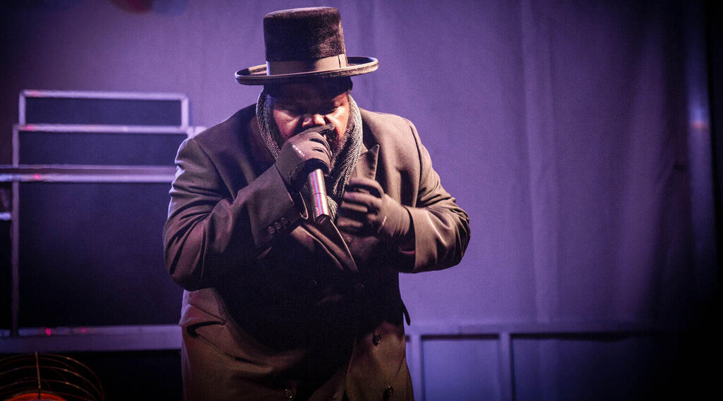 Jewish hip hop singer Nissim Black seen performing during the Chanukah festival in Pittsburgh, April 12, 2018