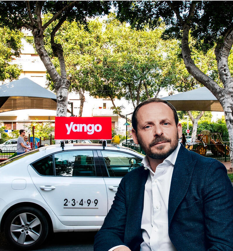 נשיא יאנדקס ארקדי וולוז' על רקע מונית של יאנגו