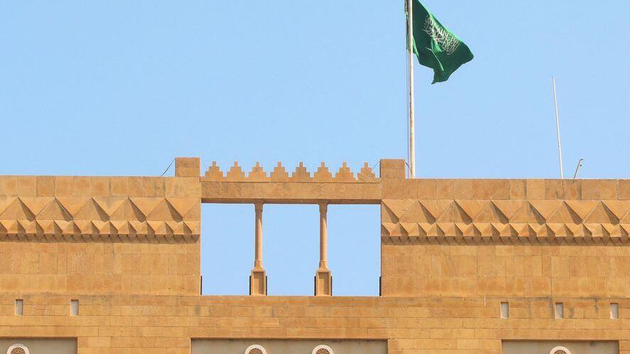 A Saudi flag flutters atop the Saudi Arabia's embassy in Beirut, Lebanon