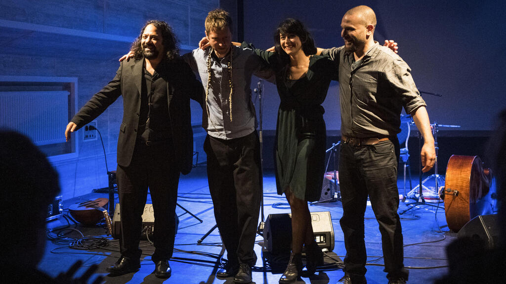 Wassim Mukdad, Borys Slowikowski, Eden Cami and Or Rozenfeld of Arab-Israeli-Jewish band Kayan Project acknowledge the applause of the audience during a concert at the Jewish theatre boat 'MS Goldberg' in Berlin
