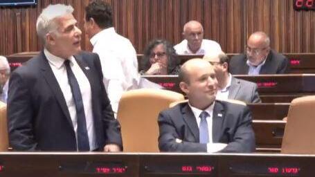 Yair Lapid and Naftali Bennett in the Knesset on Monday 