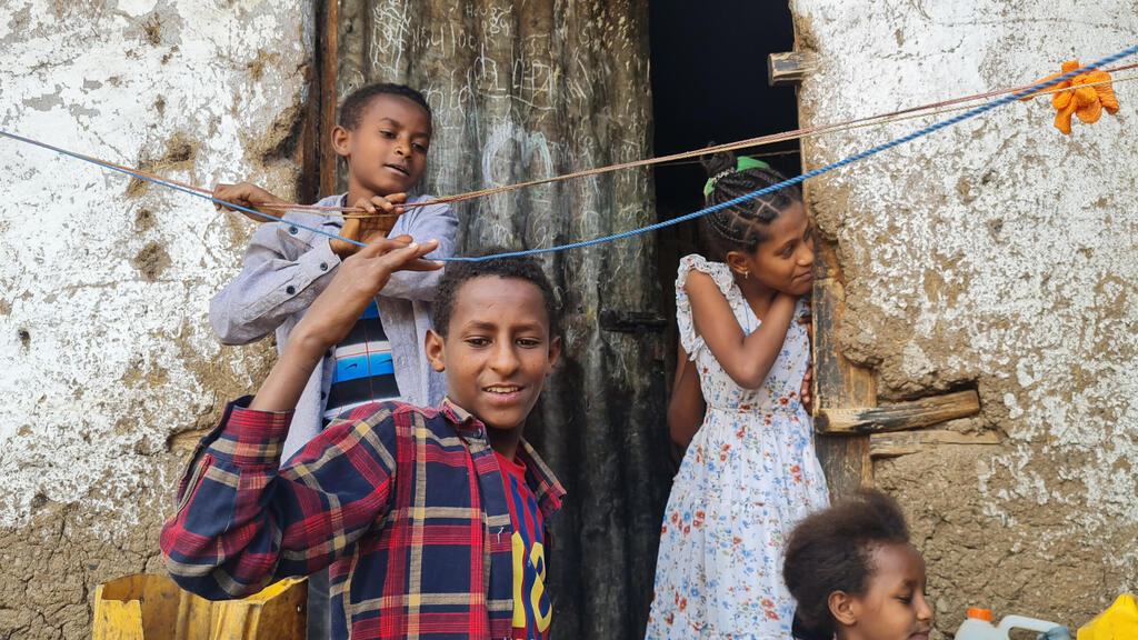 Children of Falash Mura children help hand the washing outside their home in Gondar, Ethiopia, May 29, 2022 