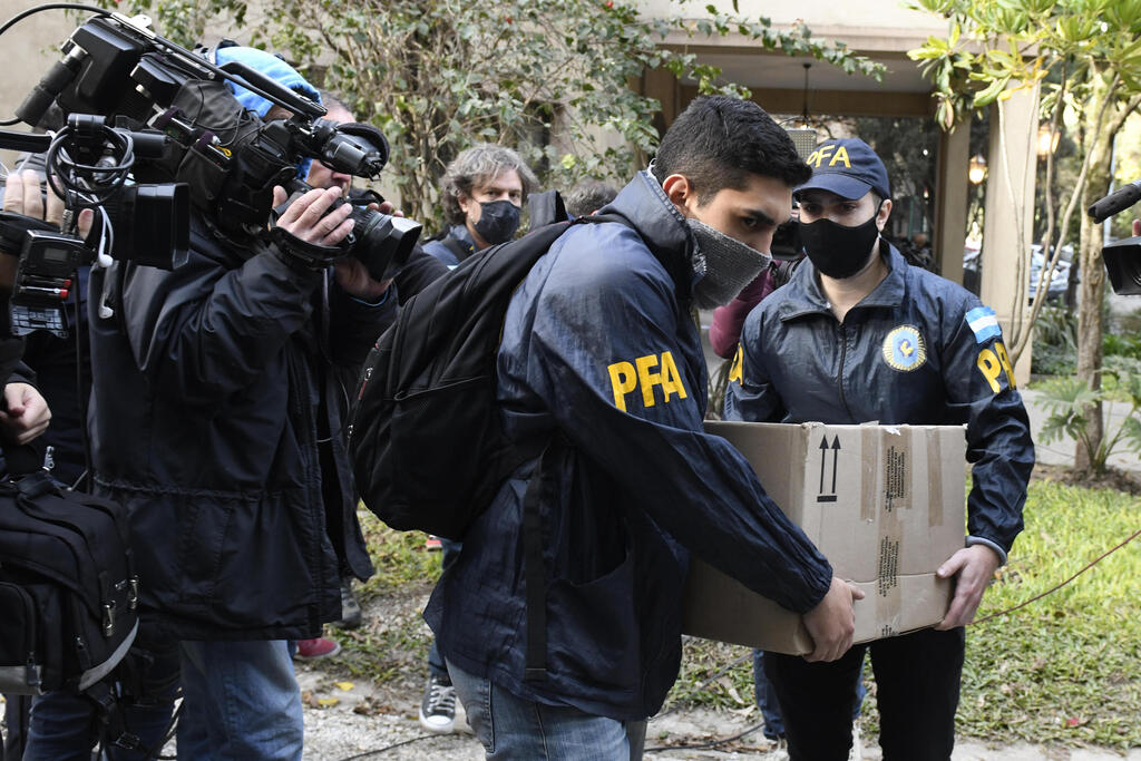 Argentinian police during raid of Plaza Central Hotel where the crew of a Venezuelan-owned Boeing 747 cargo plane reside 
