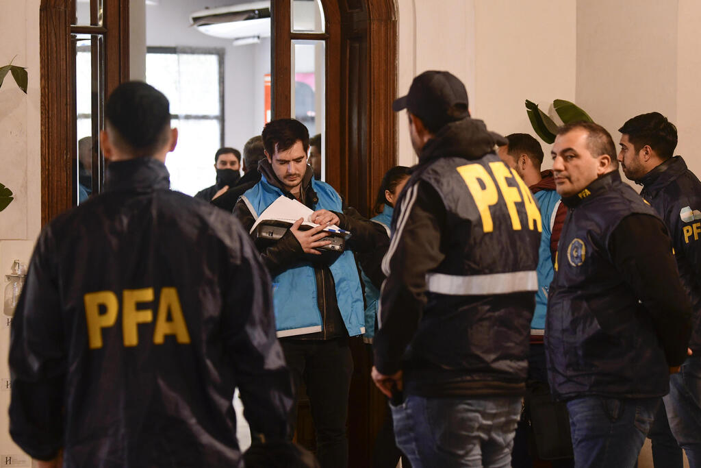 Argentinian police during raid of Plaza Central Hotel where the crew of a Venezuelan-owned Boeing 747 cargo plane reside  