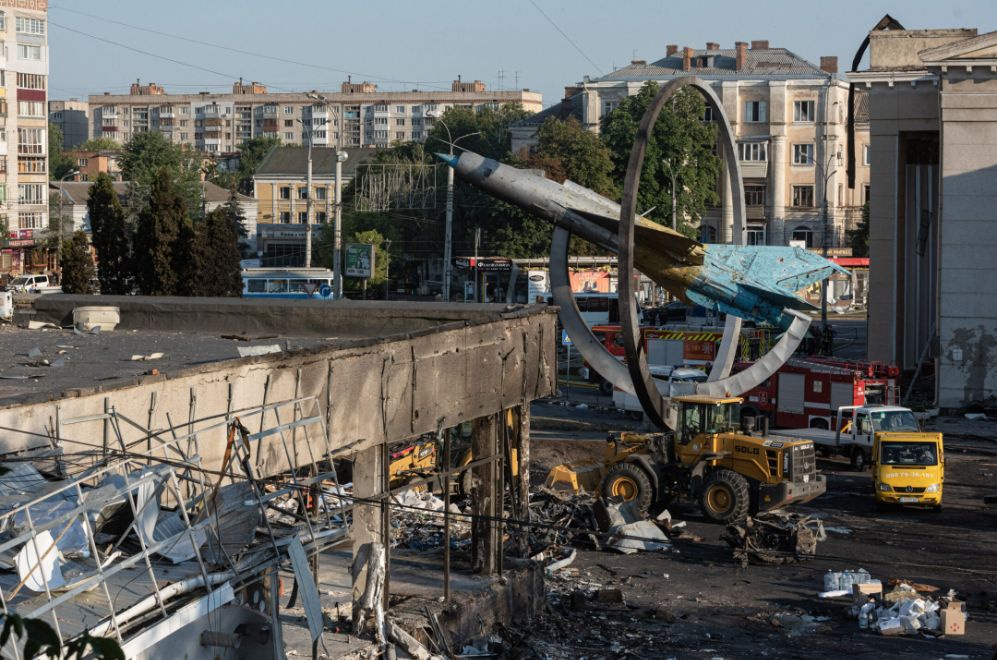 A heavily damaged office building and the monument to the military jet in Vinnytsia, Ukraine, after the Russian bombing there, July 14, 2022 