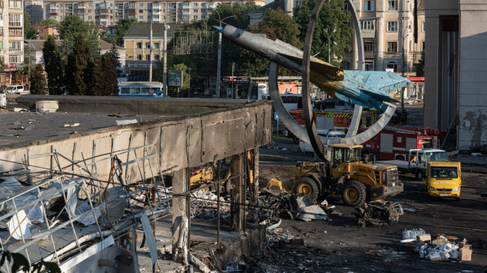 A heavily damaged office building and the monument to the military jet in Vinnytsia, Ukraine, after the Russian bombing there, July 14, 2022 