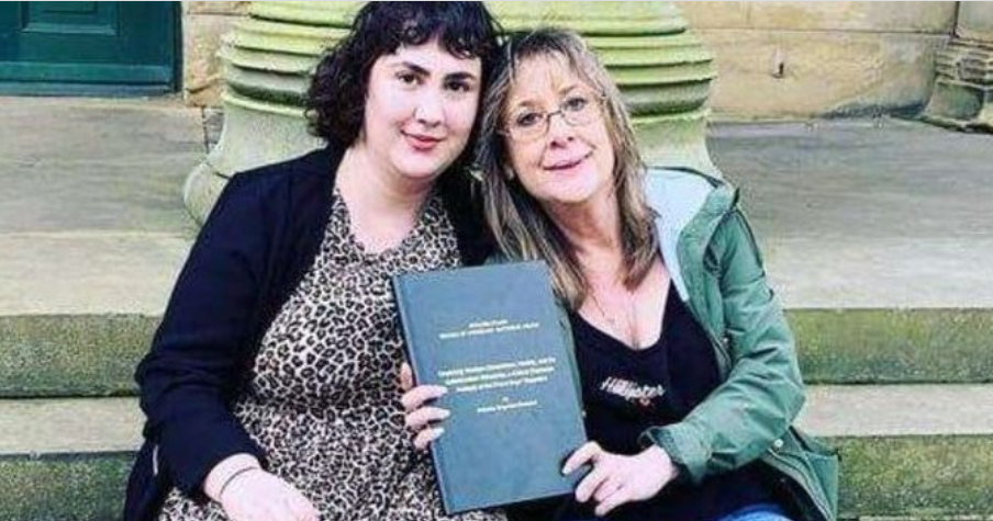 Danielle Greyman, left, pictured with her mother, displays her dissertation from the University of Leeds