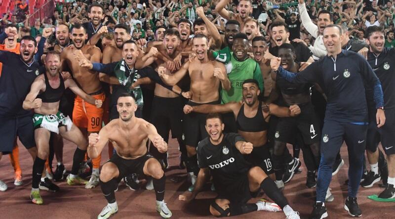 Maccabi Haifa players celebrating with fans in Belgrade 