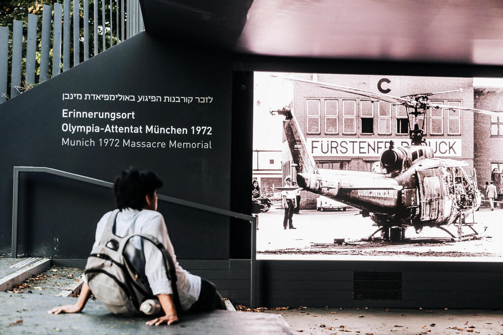 Person looks at memorial of 1972 Munich massacre 
