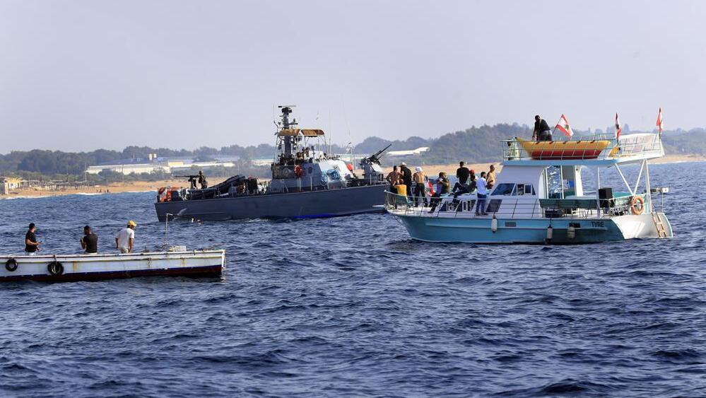 Lebanese protesters sail near an Israeli Navy vessel during a demonstration demanding Lebanon's right to its maritime oil and gas fields (Photo: AP) Lebanese protesters sail near an Israeli Navy vessel during a demonstration demanding Lebanon's right to its maritime oil and gas fields