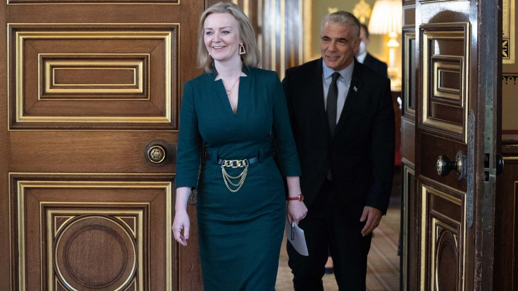 Then-U.K. Foreign Minister Liz Truss and Israeli Foreign Minister Yair Lapid meet at the U.K. Commonwealth and Development Office in London, Nov. 29, 2021 
