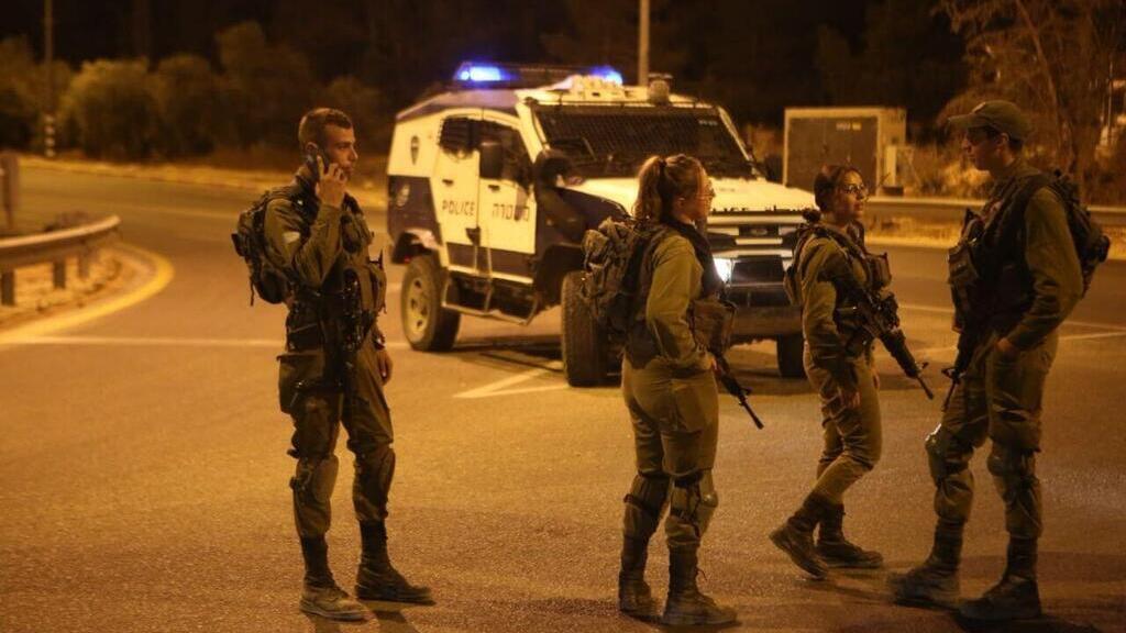 IDF troops near the West Bank settlement of Carmel after a shooting attack there 