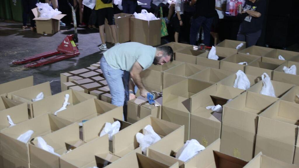 Сбор продуктовых посылок для малоимущих в Тель-Авиве (Фото: Моти Кимхи, архив) איסוף וחלוקת מזון לנזקקים בתלן אביב