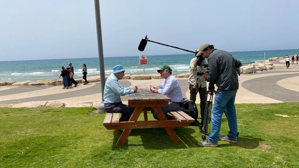 Shaul Ladany (seated, left) and Jeremy Schaap (seated, right) in Tel Aviv 