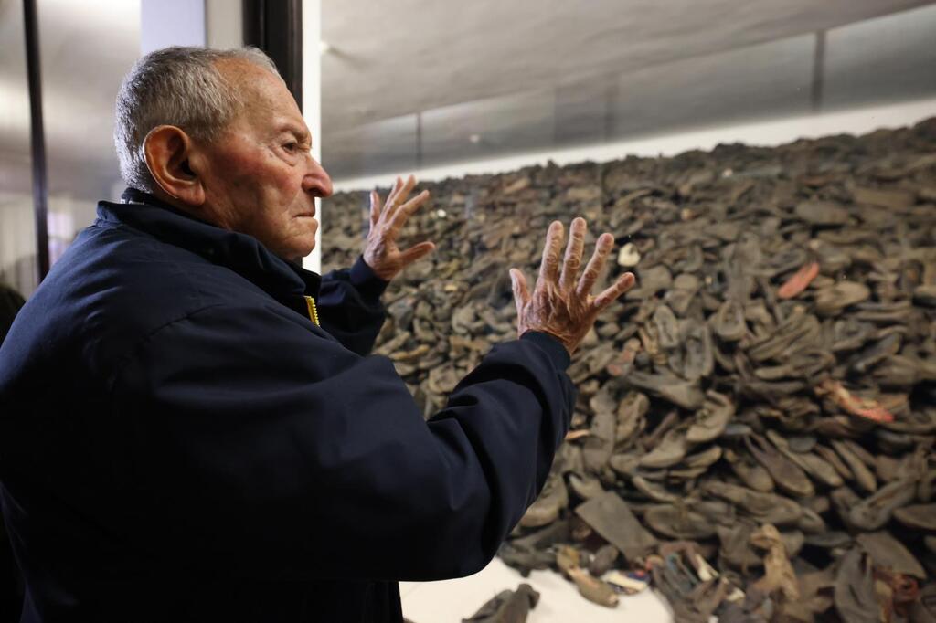 Holocaust survivor Arie Pinsker (92) inspects the collection of victims’ shoes on display at Auschwitz-Birkenau. Arie’s mother, father, and nine siblings were murdered in the camp by the Nazis. A subject of medical experiments during his time there, Arie survived the Holocaust and moved to Israel