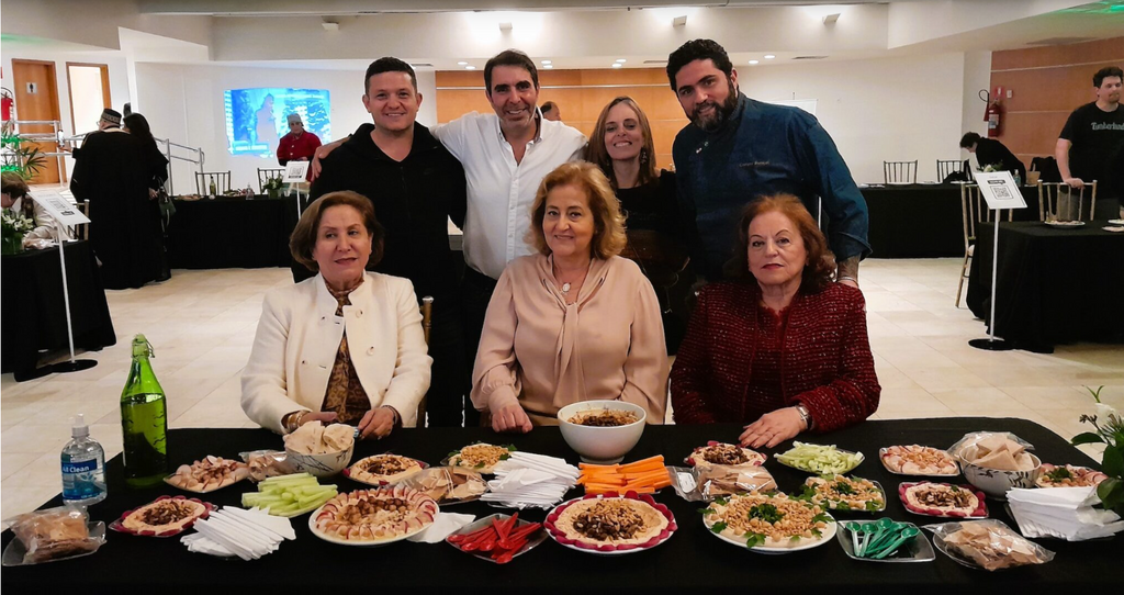 A team of three Christian Arab Brazilians, seated in front, won first place at the inaugural Abrahamic Hummus Championship in Sao Paulo, Brazil, Sept. 21, 2022 