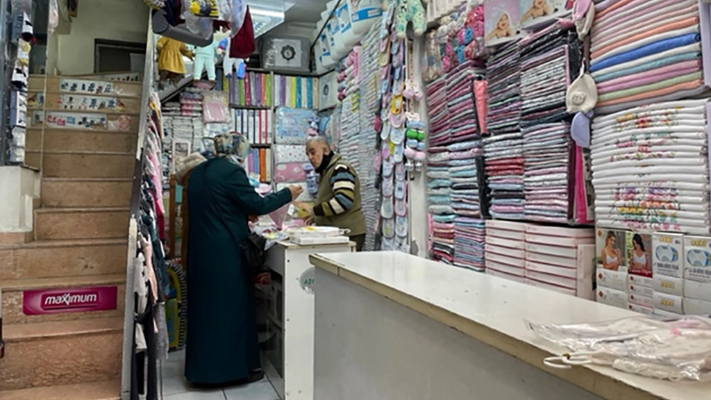 A vendor speaks with a customer in a shop in Antakya’s famed Long Bazaar 