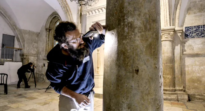 Israel Antiquities Authority researchers Shai Halevi and Michael Cherchin documenting the pilgrims’ inscriptions on the walls of the complex 