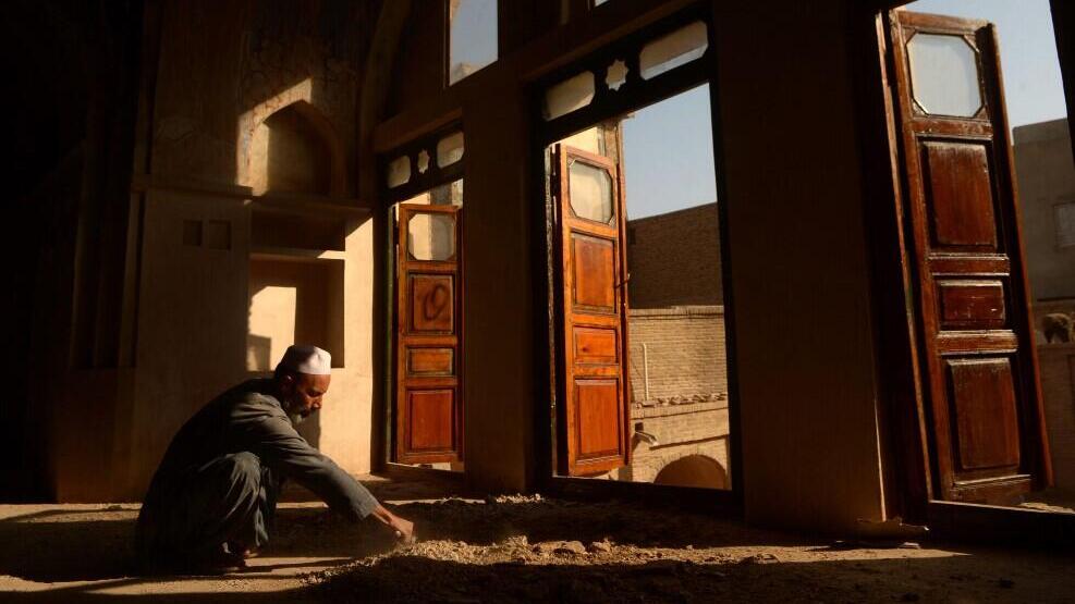 An Afghan worker reconstructs part of the Yu Aw synagogue in Herat, Afghanistan 