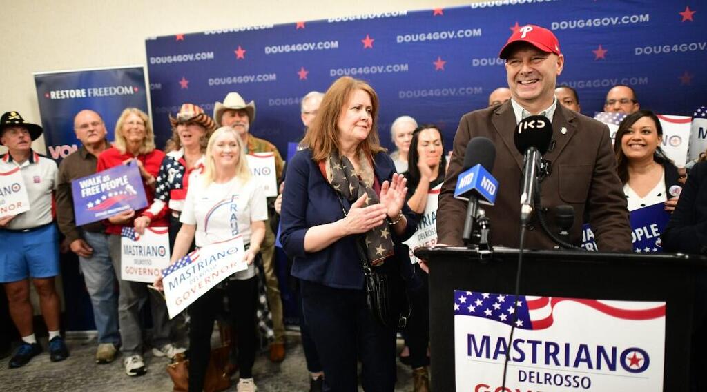 Doug Mastriano and his wife Rebecca Mastriano address the media during a rally in Manheim 