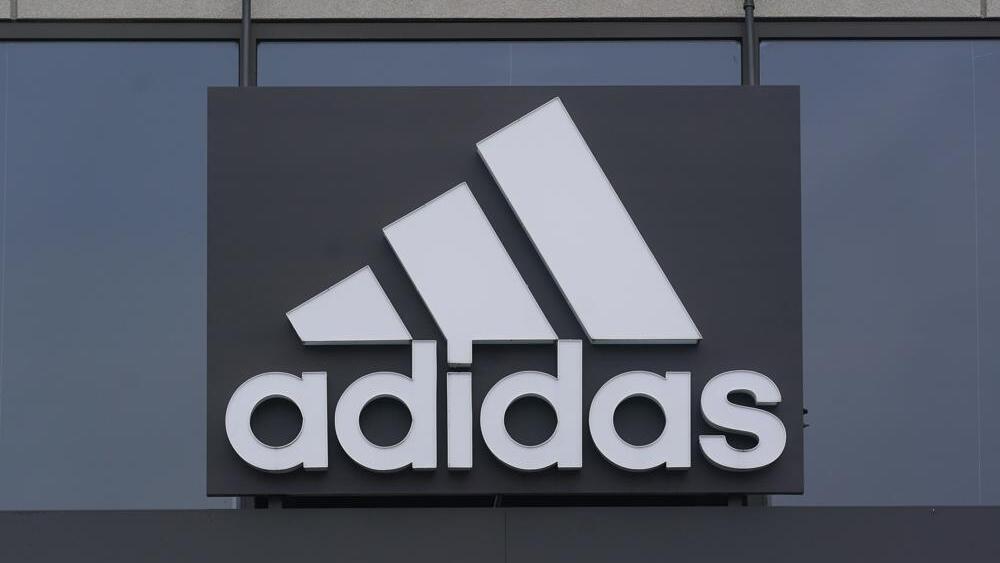 A sign is displayed in front of an Adidas retail store in Paramus, N.J., Tuesday, Oct. 25, 2022 