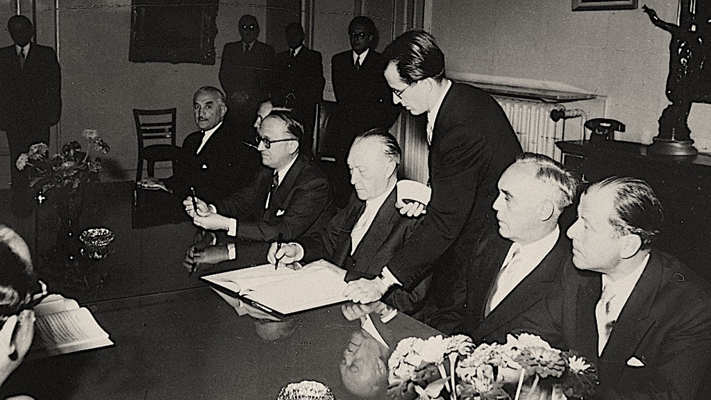 West German Chancellor Konrad Adenauer signs the reparations agreement between his country and Israel, Sept. 10, 1952 