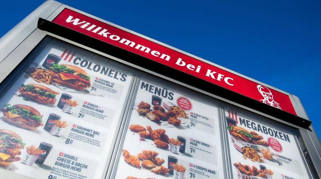 "Welcome to KFC" is written above a drive-in menu at the fast food chain Kentucky Fried Chicken (KFC) in Duesseldorf, Germany, Nov. 18, 2020.