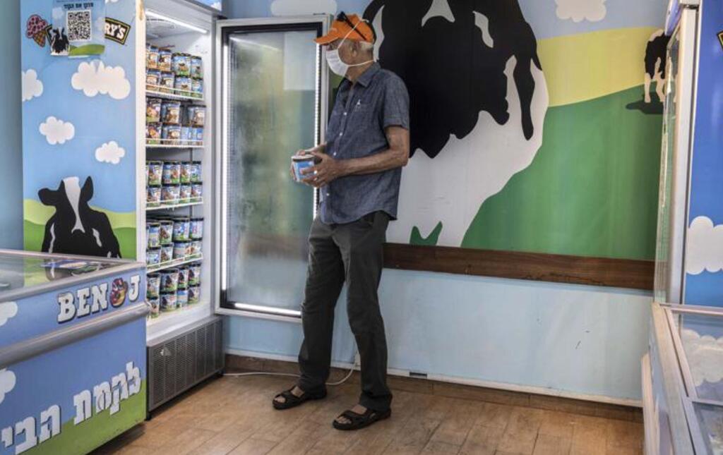 An Israeli shops at the Ben & Jerry's ice-cream factory in the Be'er Tuvia Industrial area on July 20, 2021. 