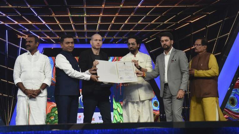 Israel filmmaker and jury chairperson Nadav Lapid, third left, being honored by Indian ministers at the closing ceremony of the International Film Festival of India in Goa, India, Monday, Nov.28, 2022