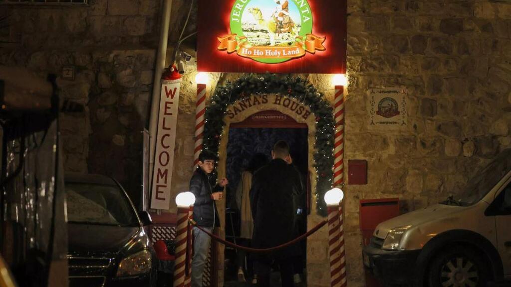 Visitors at Santa's House in Jerusalem's Old City are welcomed to the 'Ho Ho Holy Land' 