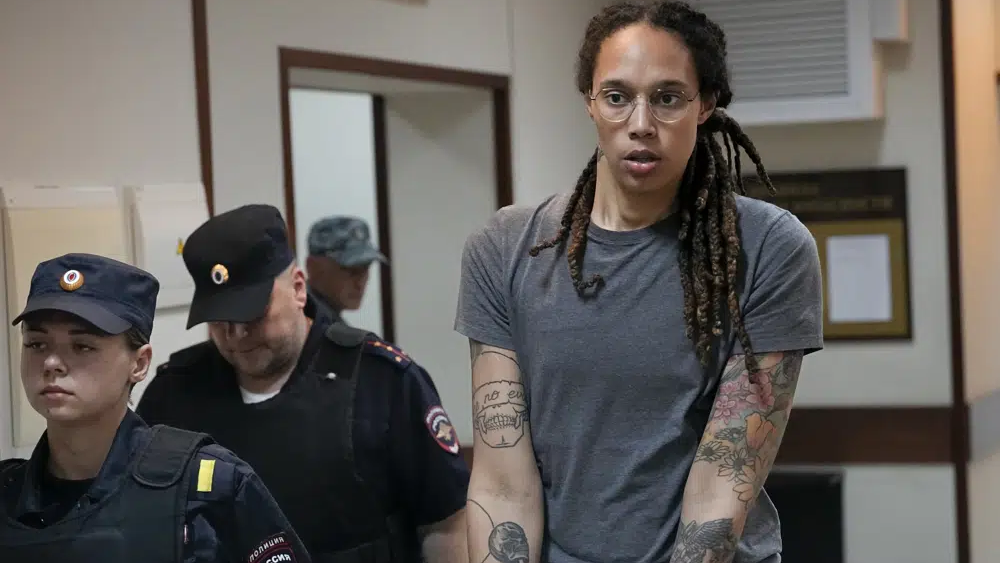 WNBA star and two-time Olympic gold medalist Brittney Griner is escorted from a courtroom after a hearing in Khimki just outside Moscow, on Aug. 4, 2022 