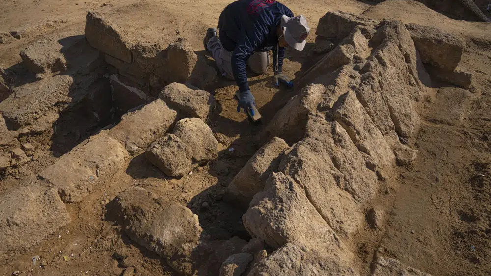 A member of a Palestinian excavation team works in a newly discovered Roman era cemetery in the Gaza Strip, Sunday, Dec. 11, 2022 