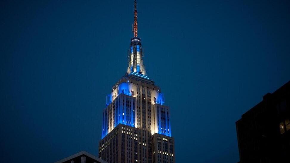 The Empire State Building is illuminated with blue and white lights in celebration of Hanukkah, an annual New York City tradition 