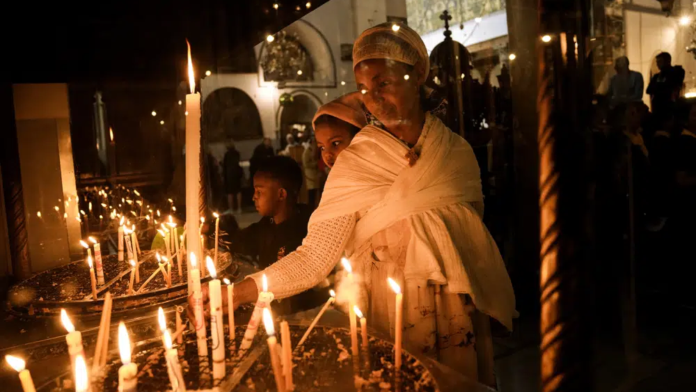An Ethiopian woman and her child visit the Church of the Nativity, traditionally believed to be the birthplace of Jesus Christ, in the West Bank town of Bethlehem, Saturday, Dec. 3, 2022 