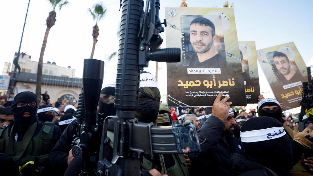 Palestinian militants rally over Israel's refusal to transfer terrorist's body 