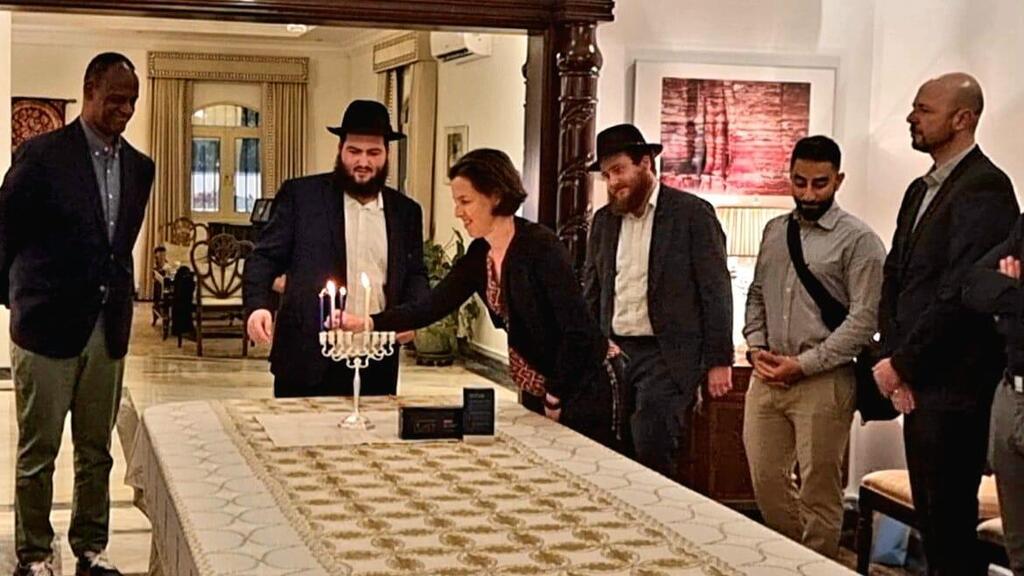Qatari Foreign Ministry staff lit a candle on the third night of Hanukkah at the U.S. Embassy in Doha צוות משרד החוץ בקטאר הדליק נר שלישי של חנוכה בשגרירות ארצות הברית בדוחא