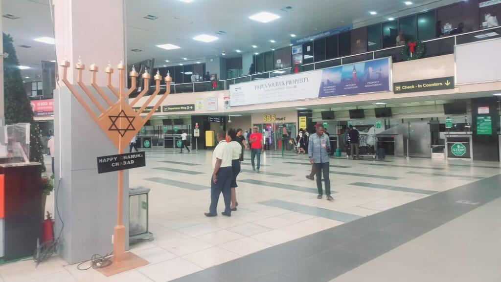 A menorah placed at the main hall of the Murtala Muhammed International Airport in Lagos, Nigeria חנוכיות ראשונות הוצבו בשדה התעופה בניגריה