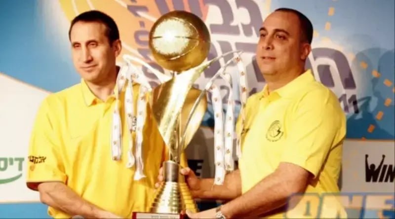 Blatt (left) holding the State Cup 