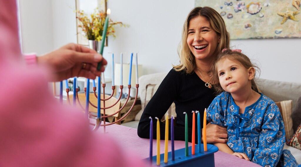 Each member of the family lights their own menorah on Hanukkah, the couple said