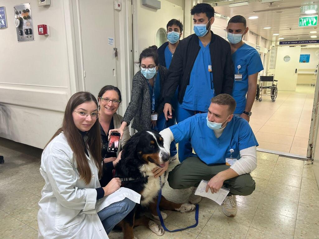 Staff showing their love for the therapy dog