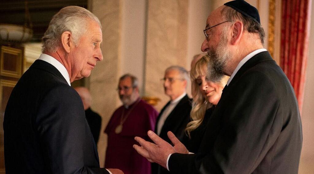 King Charles III meets Rabbi Ephraim Mirvis during a reception with faith leaders at Buckingham Palace in London 