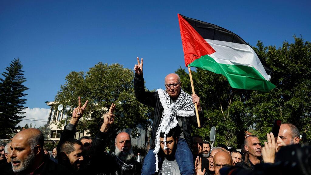 Longest serving Palestinian prisoner, Karim Younis, gestures as he is welcomed at his village, after he was freed from Israeli jail earlier today, in Ara, Israel January 5, 2023 