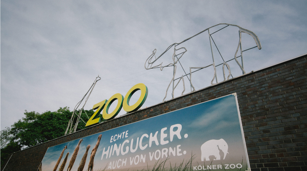The Cologne Zoo logo is seen from the entrance 