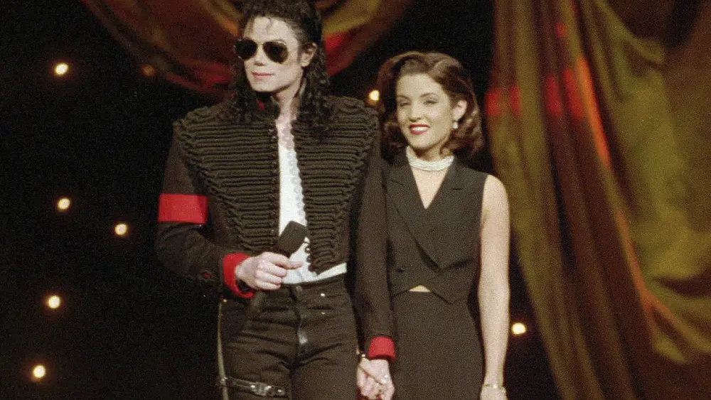 Michael Jackson and Lisa Marie Presley-Jackson acknowledge applause from the audience after coming out onstage to open the 11th annual MTV Video Music Awards at New York's Radio City Music Hall, Sept. 8, 1994 