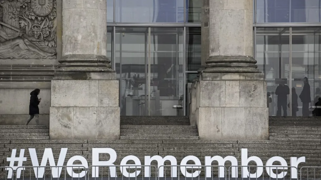 The lettering #WeRemember is seen on the stairs leading to the Reichstag building hosting the German lower House of parliament, the Bundestag, in Berlin as part of the ceremonies for the International Holocaust Remembrance Day held on January 27 